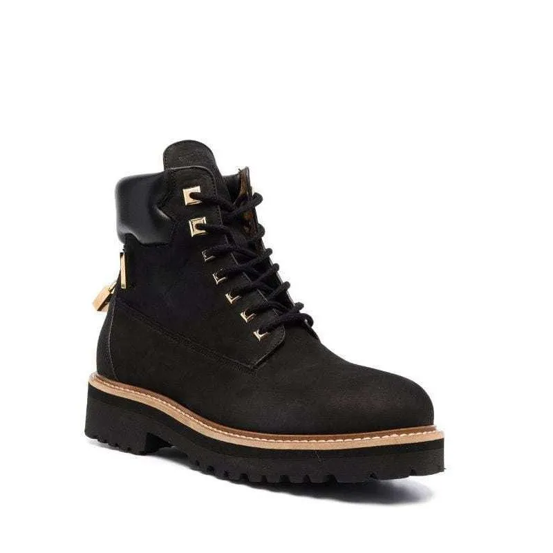 Cap toe Lace-up vamp with lock strap closure Goldtone hardware Rubber sole Made in Italy