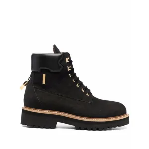 Cap toe Lace-up vamp with lock strap closure Goldtone hardware Rubber sole Made in Italy