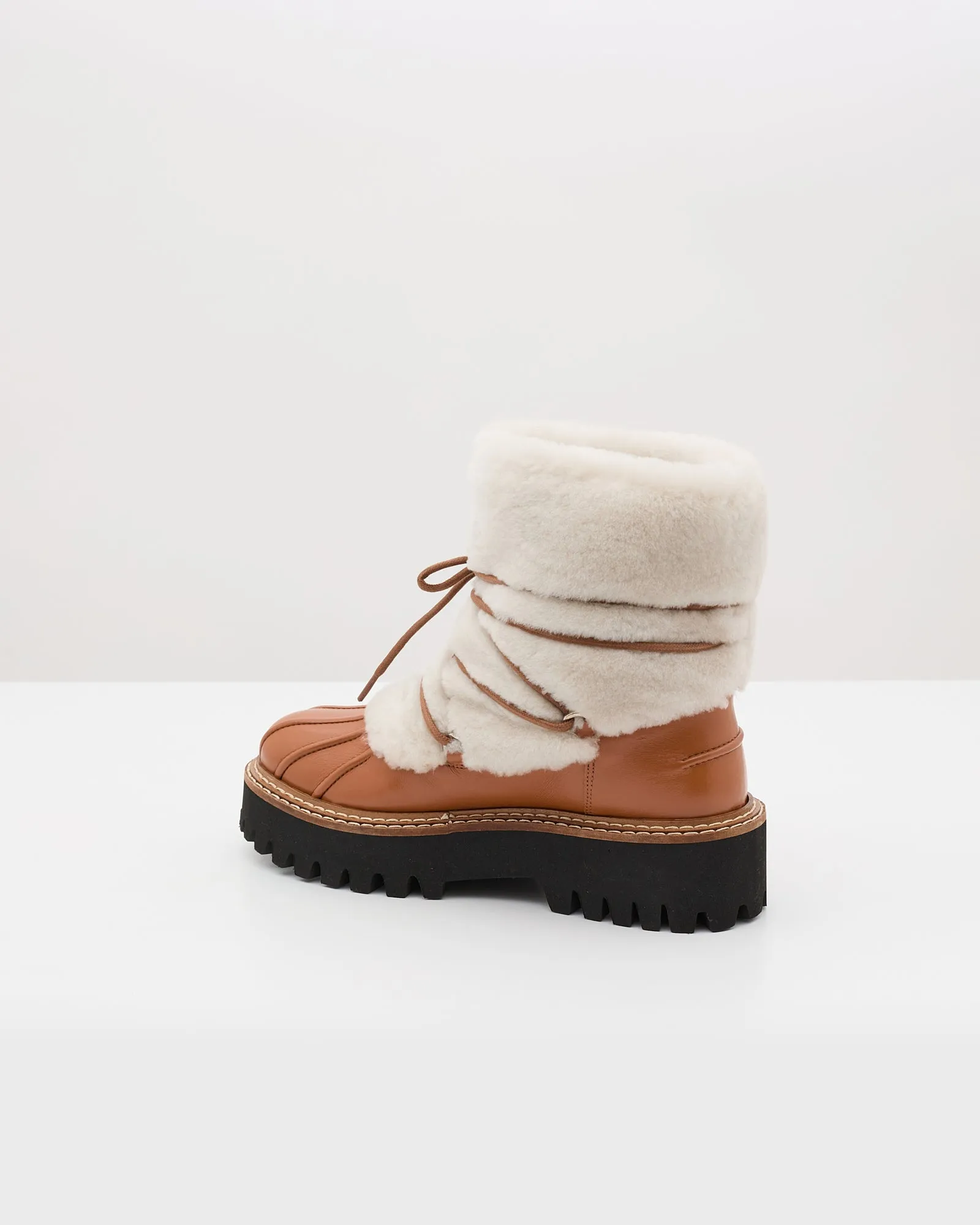 Lace-up mid-length boots in ironed Merino